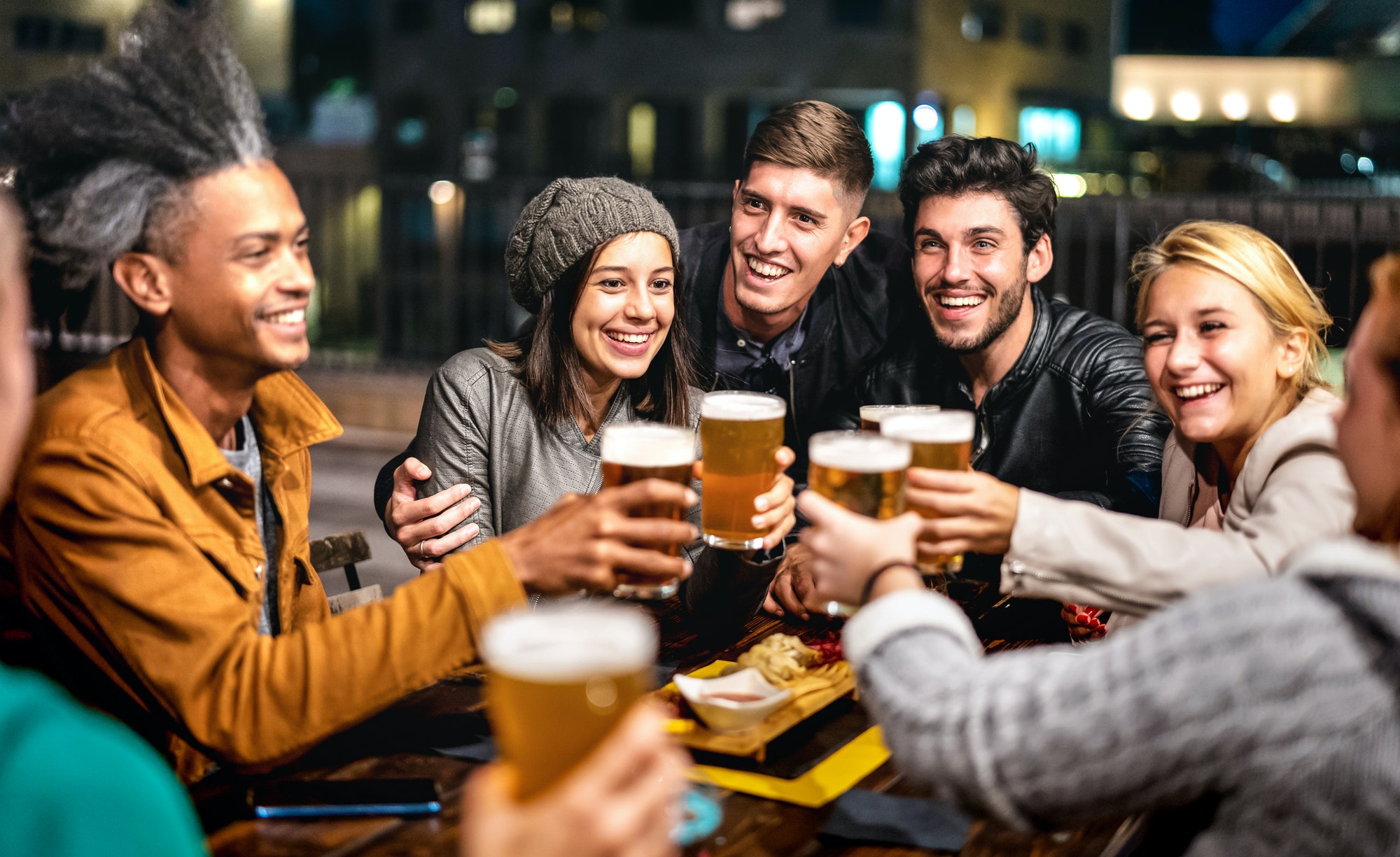 happy-friends-group-drinking-beer-at-brewery-bar-outdoors.jpg